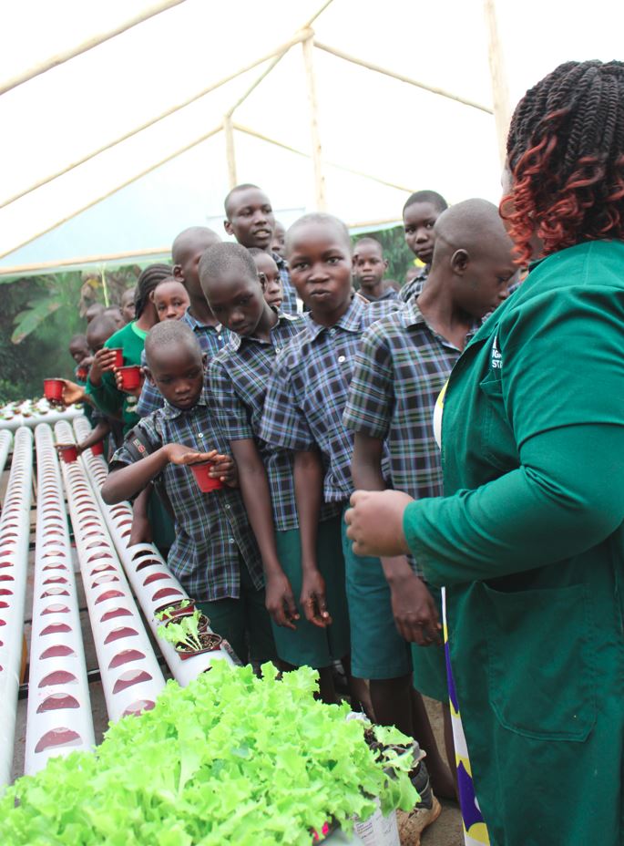 Students learning hydroponics at Wakadogo School Gulu
